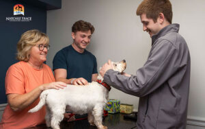 Couple consulting an NTVS vet about dog's health