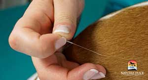 Vet placing a very small needle in dog
